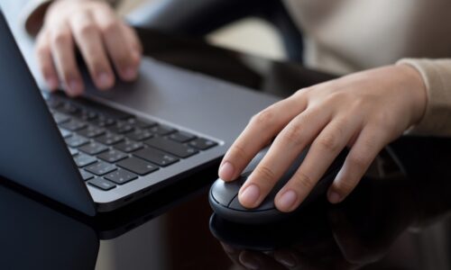 Closeup,Business,Person,Hand,Using,Wireless,Mouse,And,Work,With