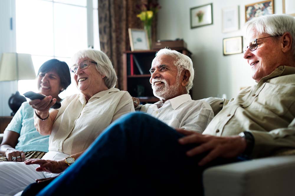 elderly people watching tv