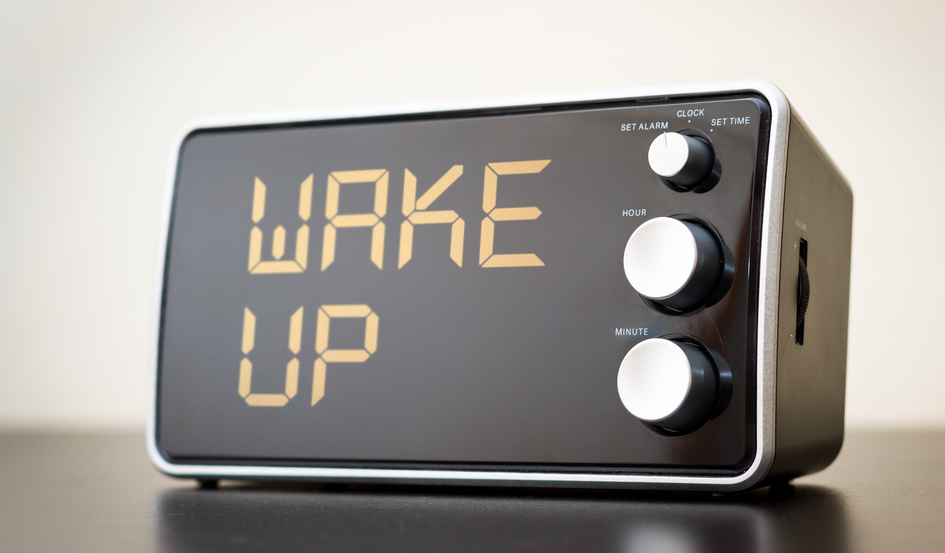 alarm clock which says wake up