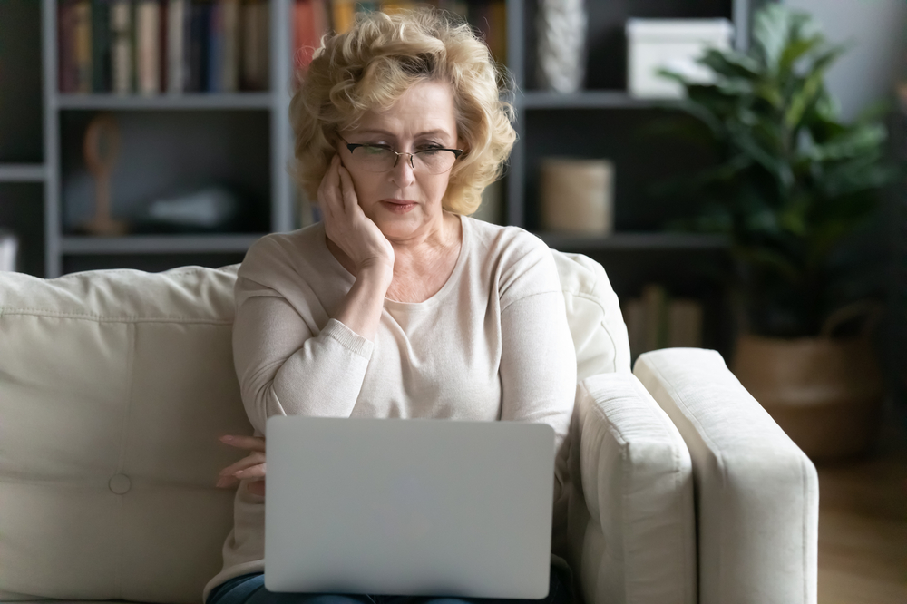 pension scam woman looking worried