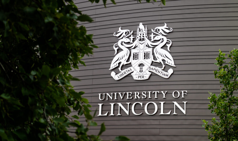 university of lincoln logo on the side of a building