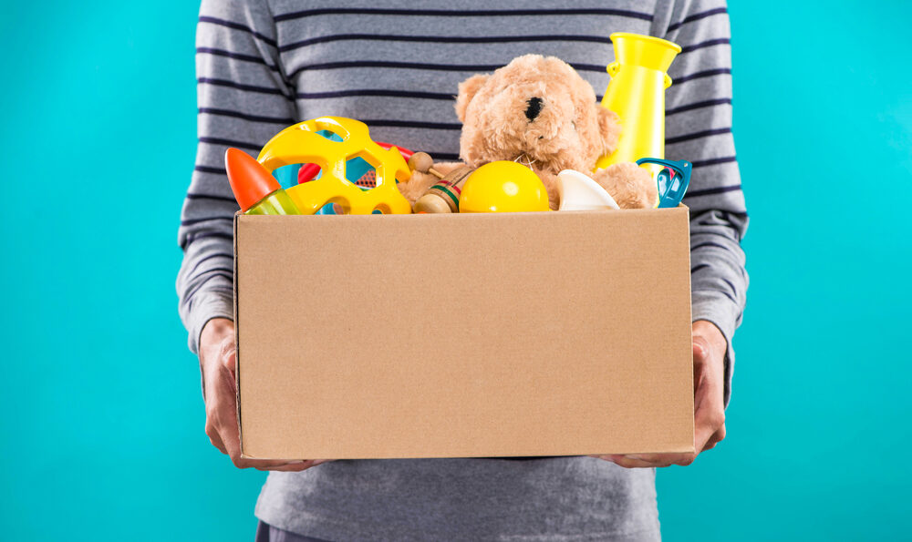 person holding a box of toys