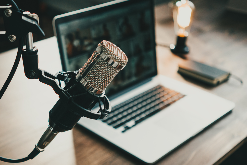 Laptop set up with a podcast microphone.