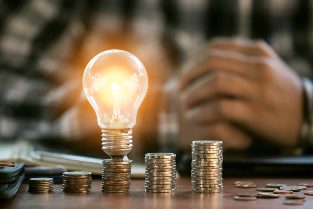 Lightbulb on a stack of coins