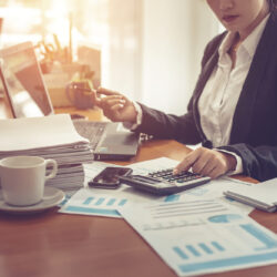 Business,Woman,Using,Calculator,And,Writing,Make,Note,With,Calculate.