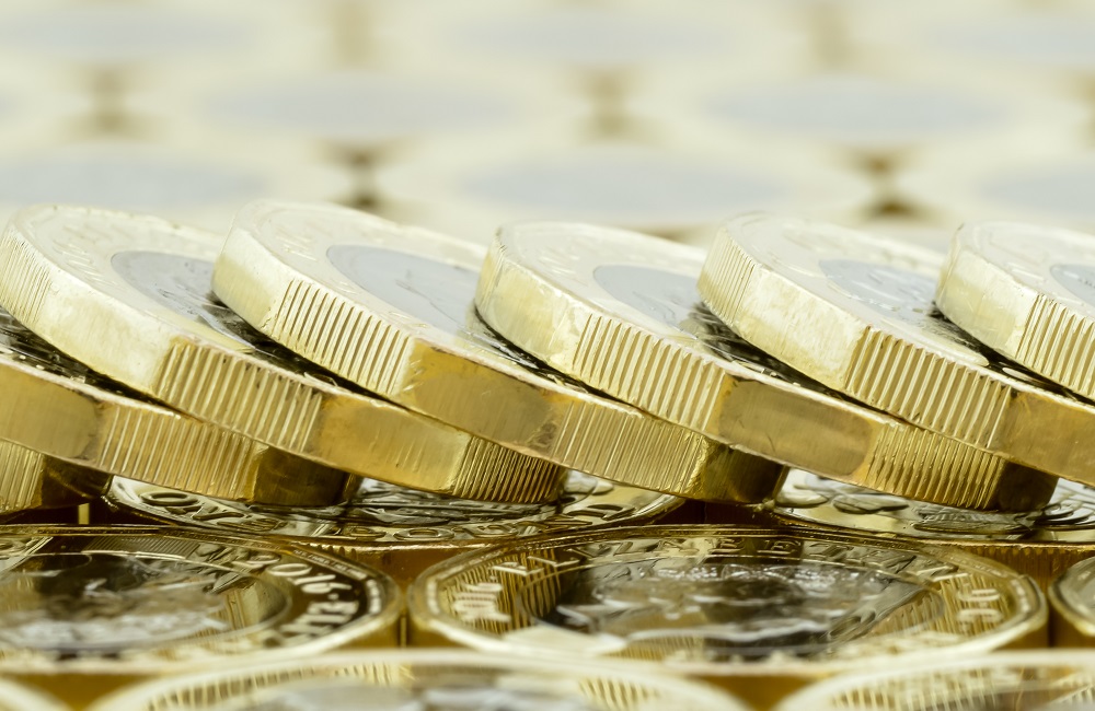 A,Fallen,Stack,Of,New,One,Pound,Coins,On,A